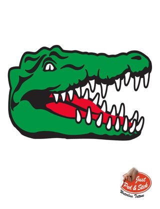 A colorful temporary tattoo of a smiling alligator with teeth showing.